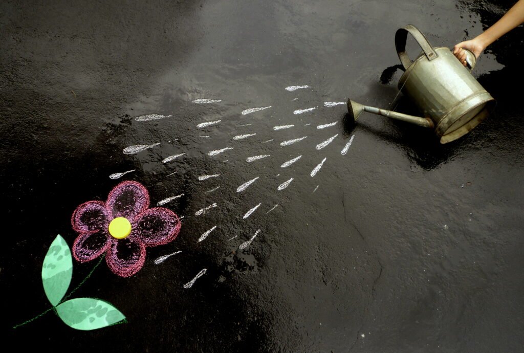 Watering the flower. | Panasonic Lumix DMC FS15